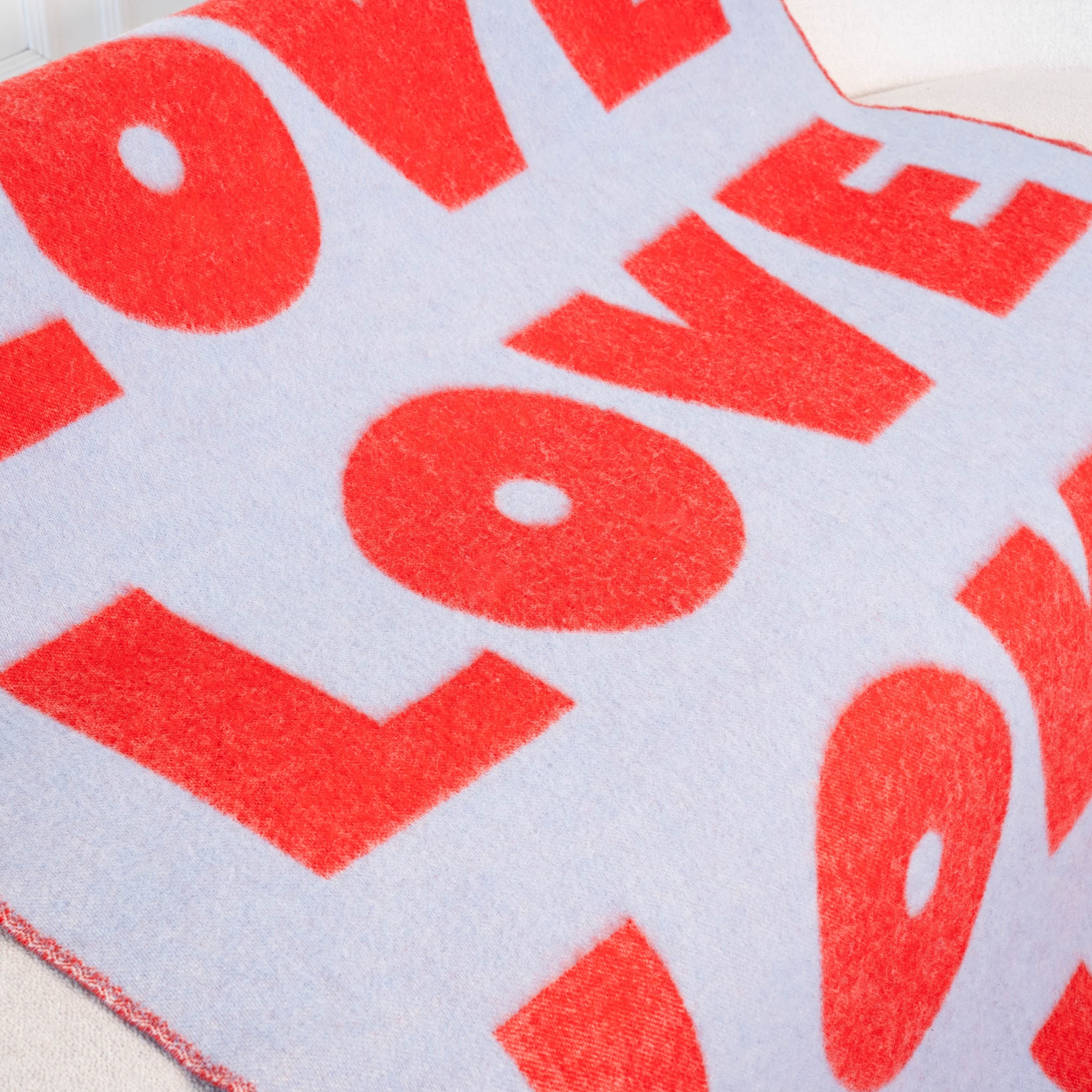 Texture detail of red and light blue wool blanket – WOLIQ Endless Love