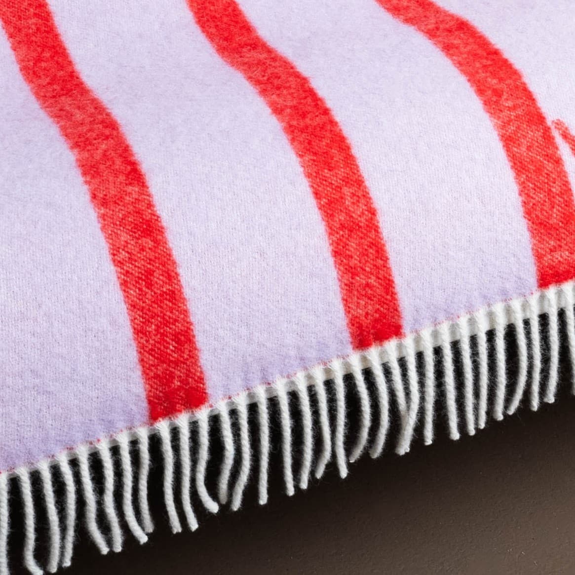 Texture detail of pink and red striped wool blanket – WOLIQ Hug Me