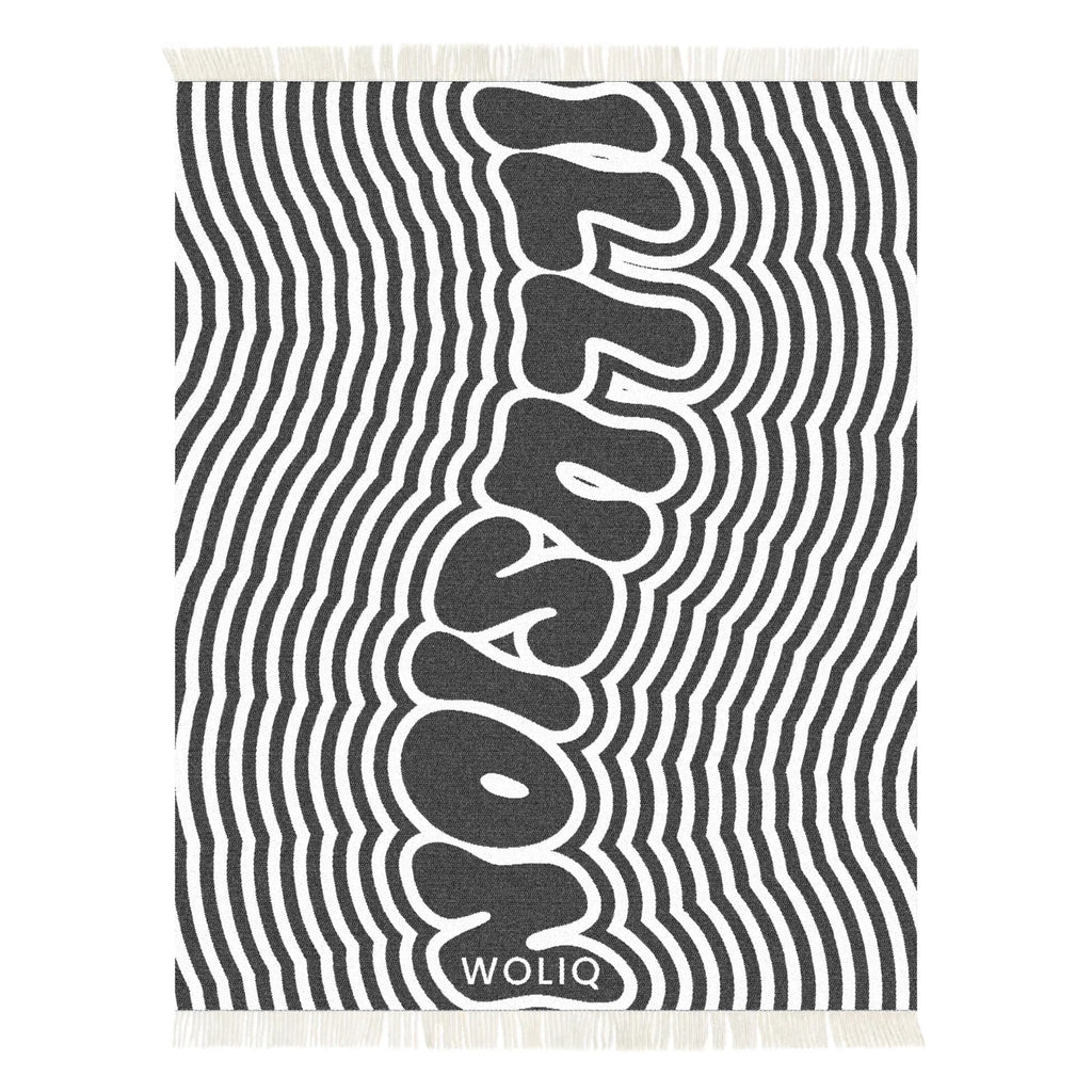 Black and white illusion text wool blanket – WOLIQ Illusion Wave front view