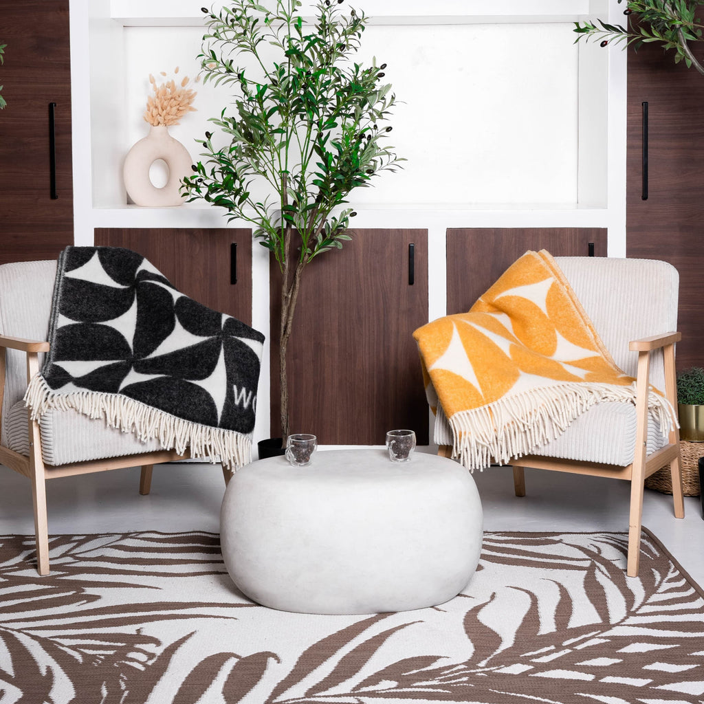 Black and white Bauhaus wool blanket on chair – WOLIQ Mono Bauhaus