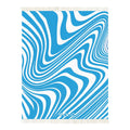 Blue and white wavy pattern wool blanket – WOLIQ Ocean Rhythm front view