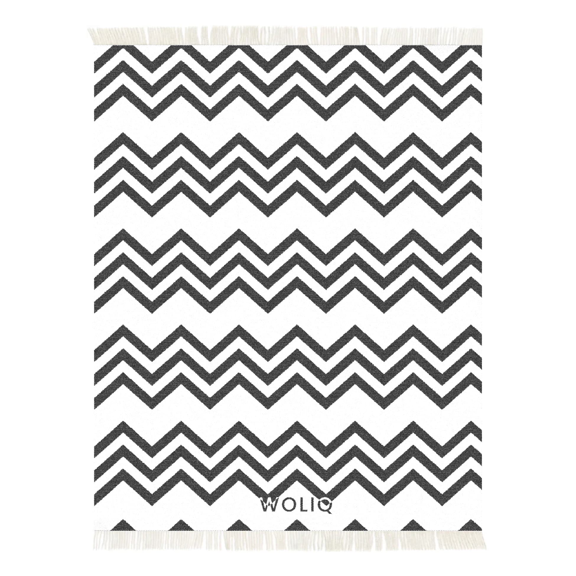 Black and white zigzag wool blanket – WOLIQ Static Motion front view